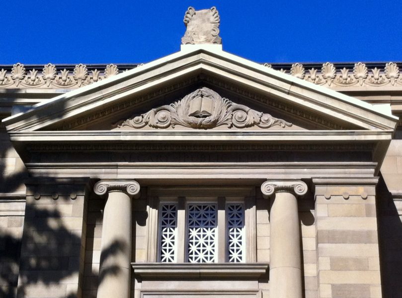 Image of the relief of an open set above the main entrance of the Memorial Park Library